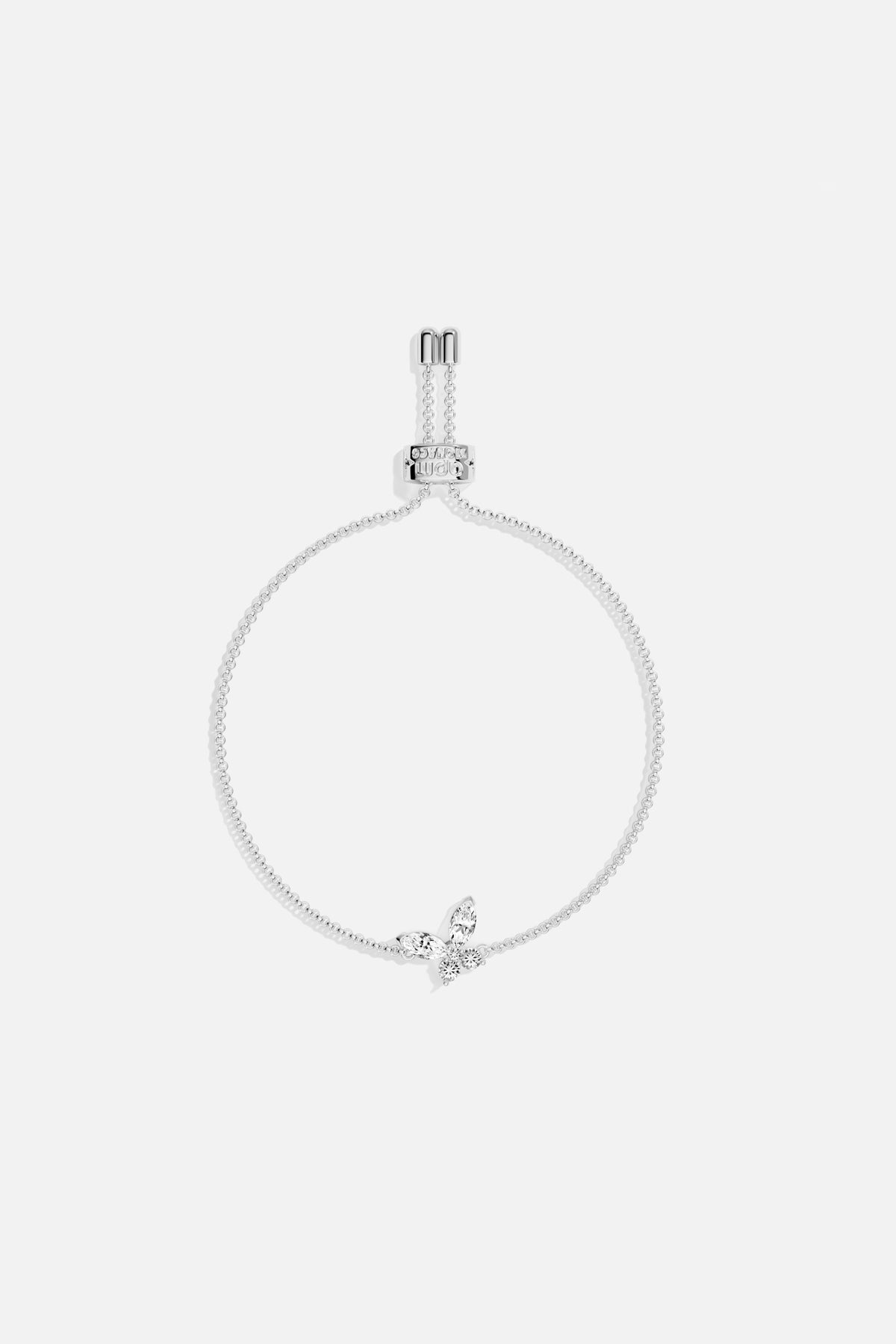 Bracelet APM orné d'un papillon scintillant, une envolée délicate au poignet.