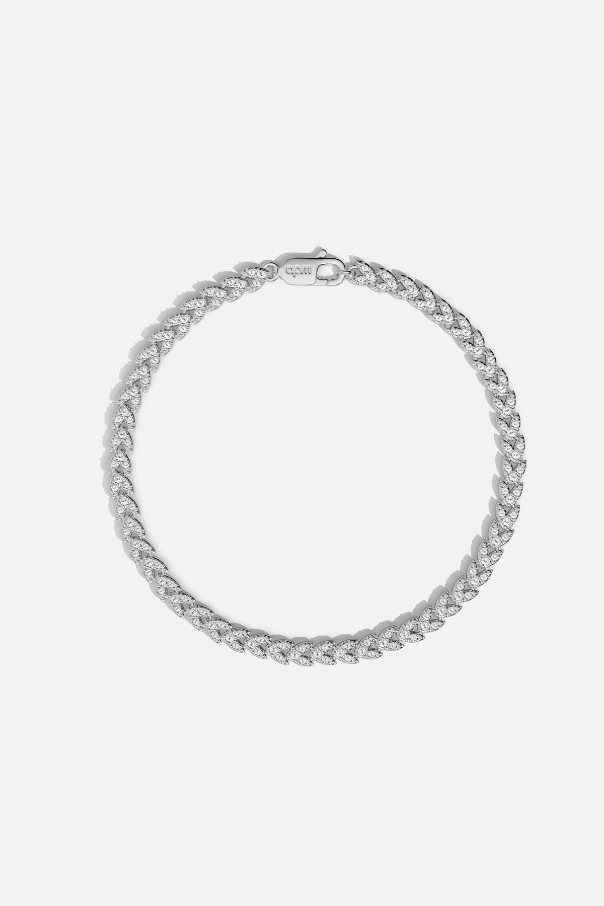 Bracelet APM en maille gourmette scintillante, éclat contemporain au poignet.