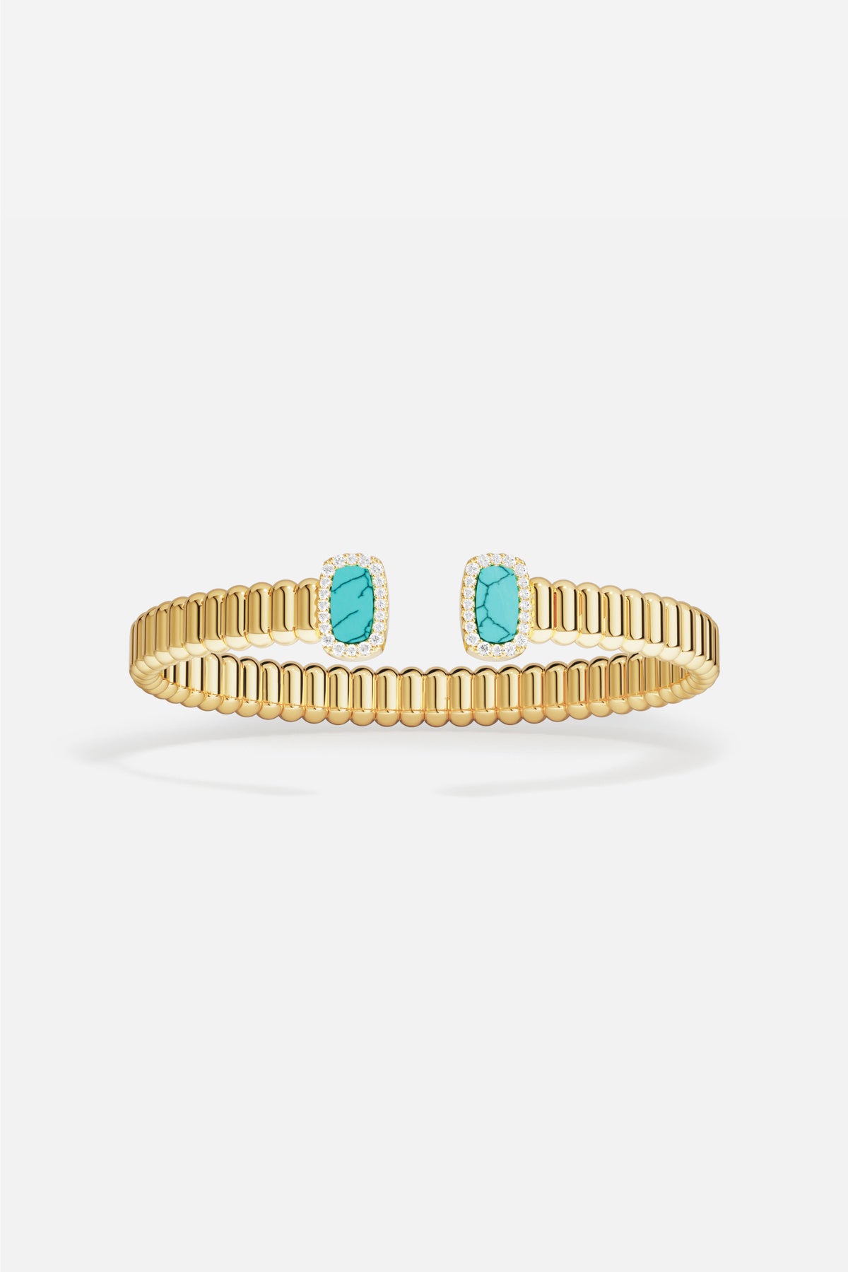 Bracelet APM doré ouvert, touches turquoise lumineuses pour une élégance solaire et contemporaine.
