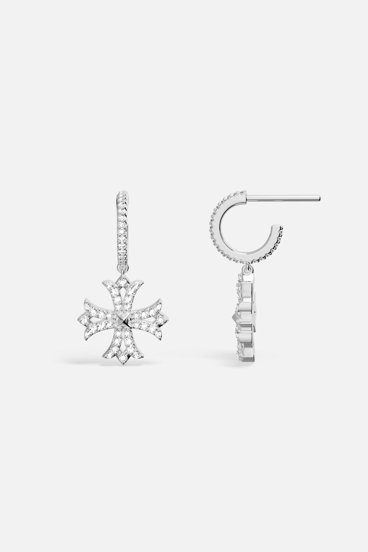 Boucles d'oreilles APM Monaco, une étoile scintillante suspendue avec élégance contemporaine.