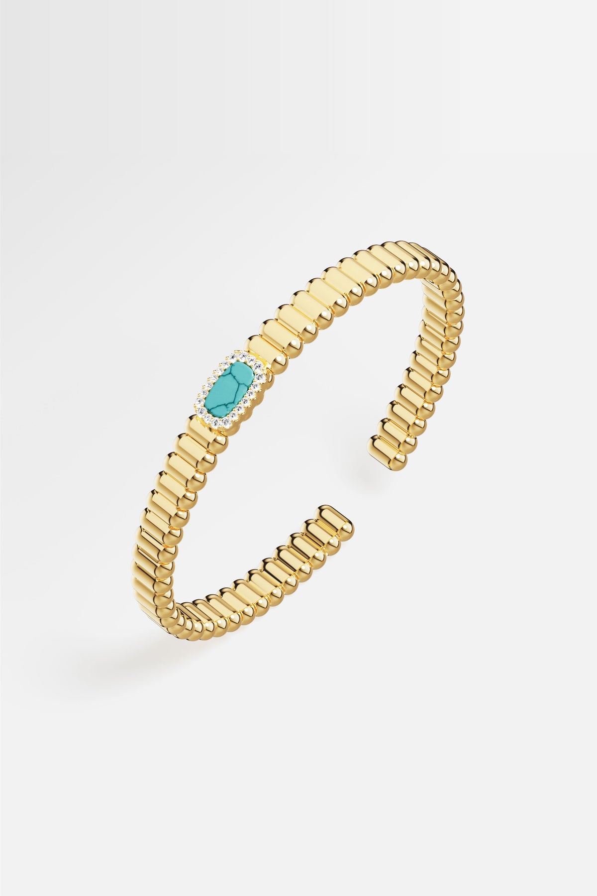 Bracelet APM aux reflets dorés, une touche turquoise pour un éclat solaire.