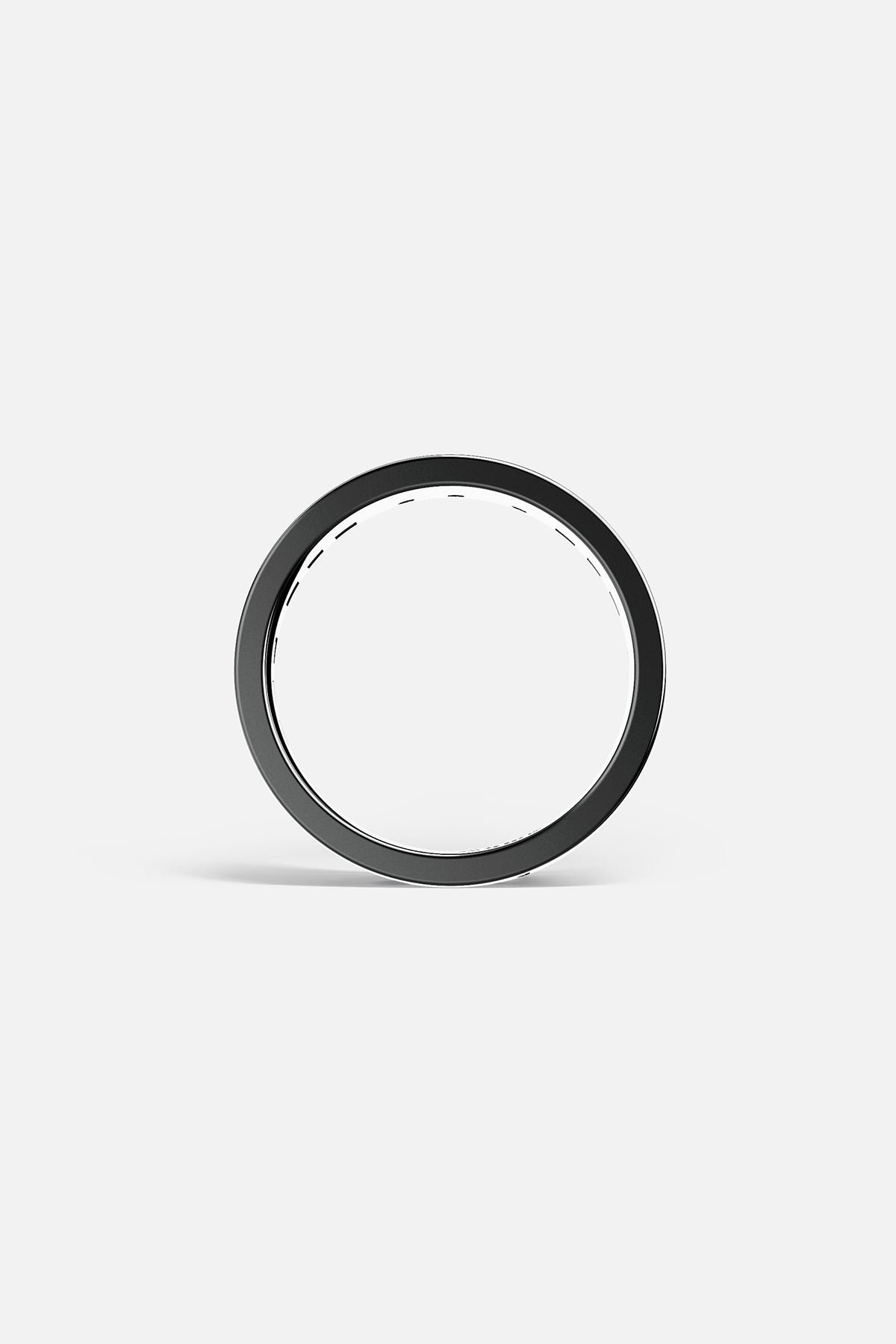 Close-up of a hand holding a smart ring with a blurred background