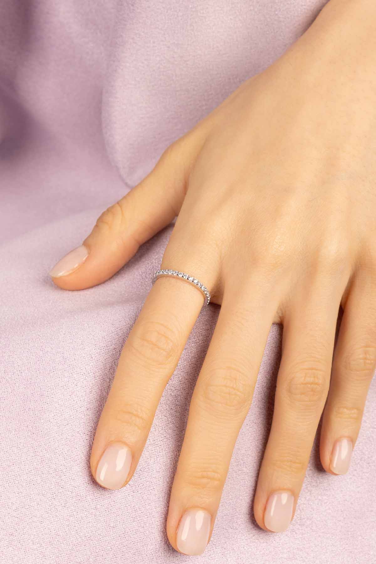 Rings APM Monaco, silver-tone ring with a linear pavé of small stones along the top band.
