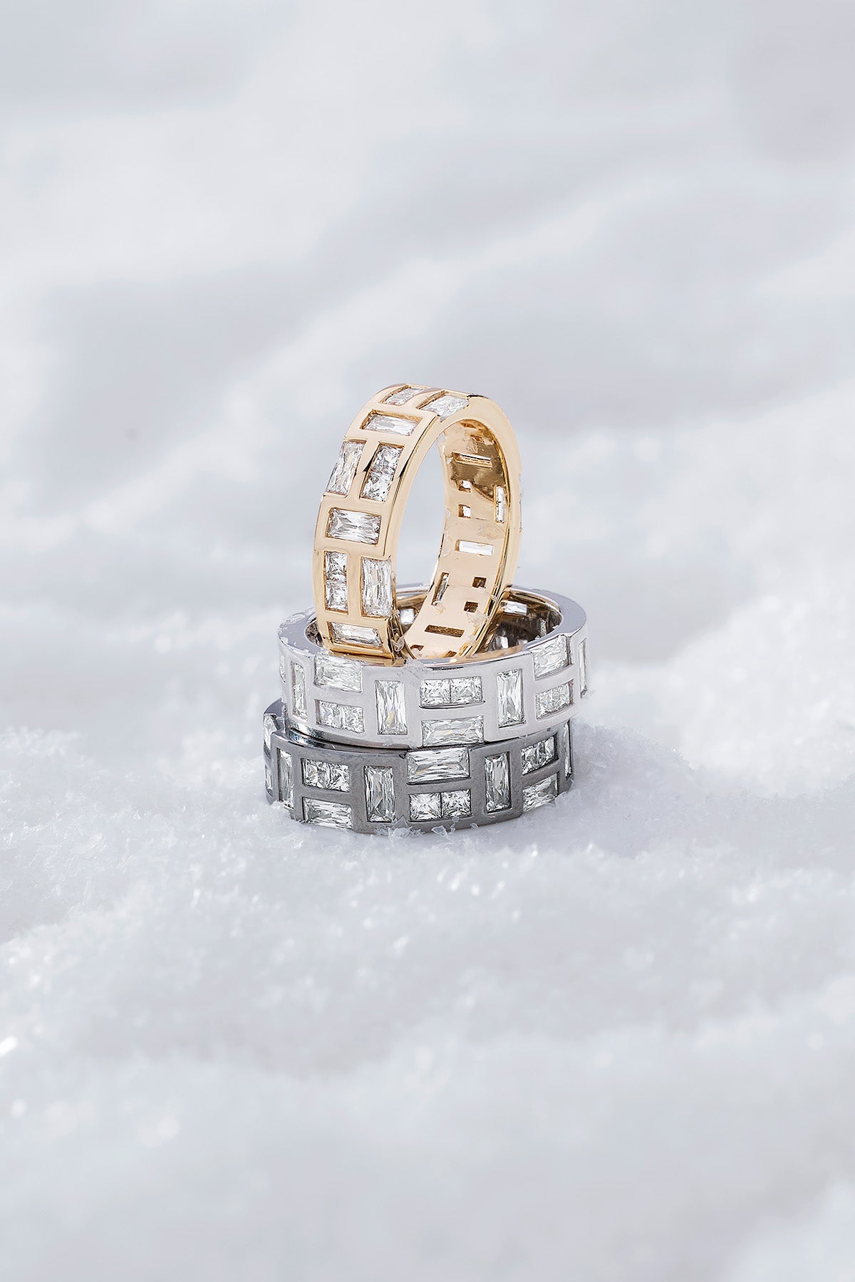 Three labyrinth rings from APM MONACO on a white snowy background