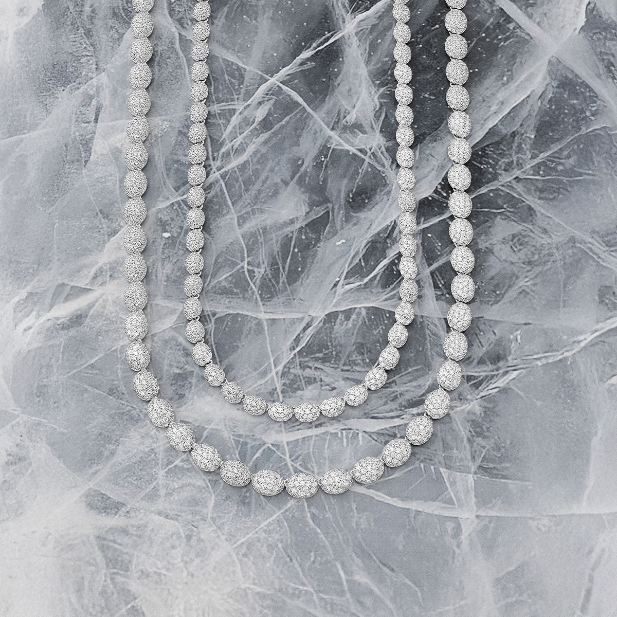 APM MONACO Hiver necklace in silver on iced surface