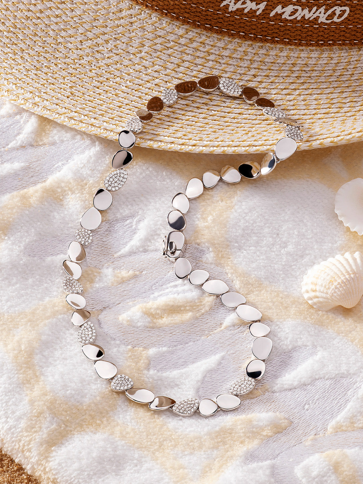 APM Monaco Collection Ete Galet Silver Choker on beach towel