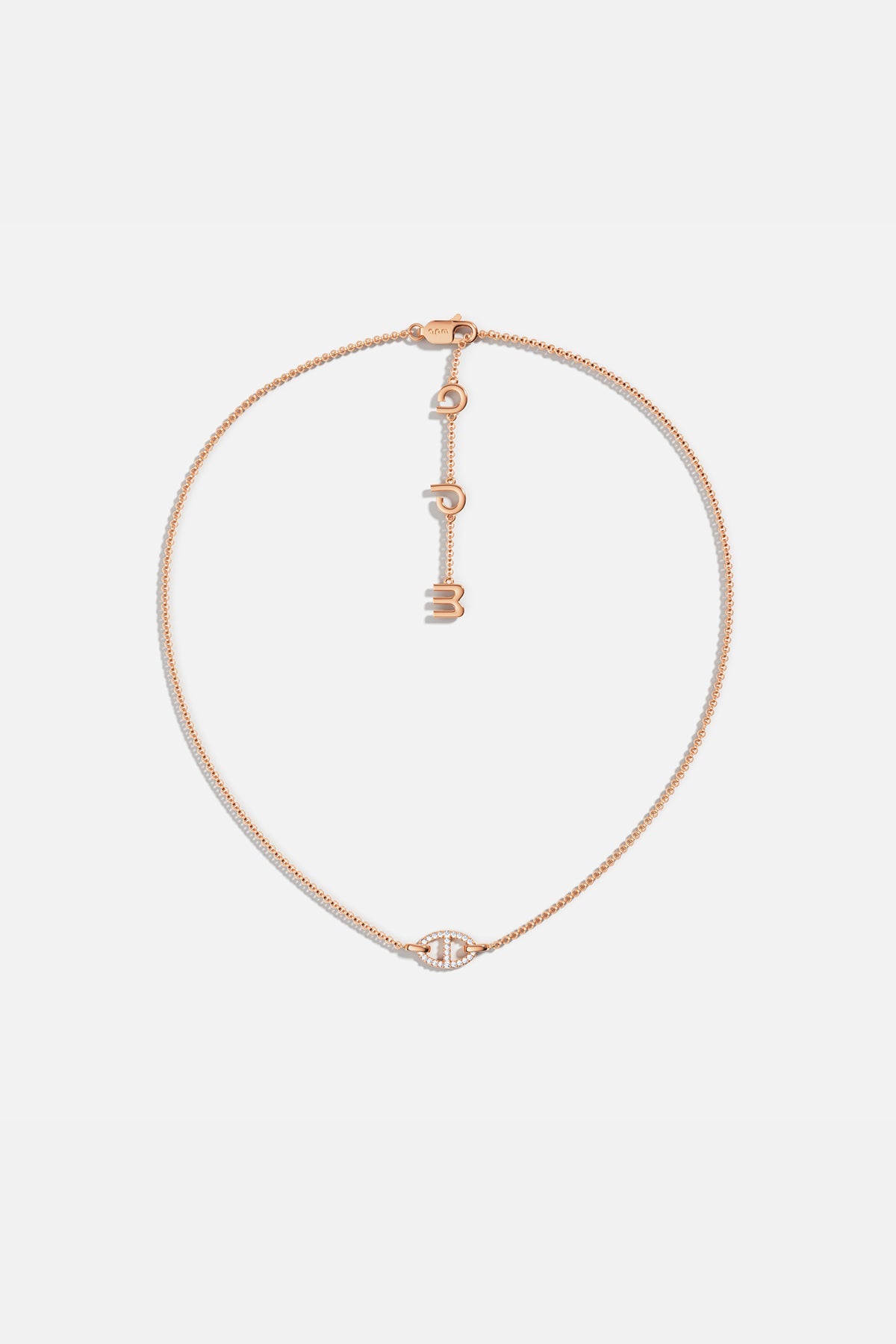 APM MONACO rose gold necklace with unique pendant on a white background