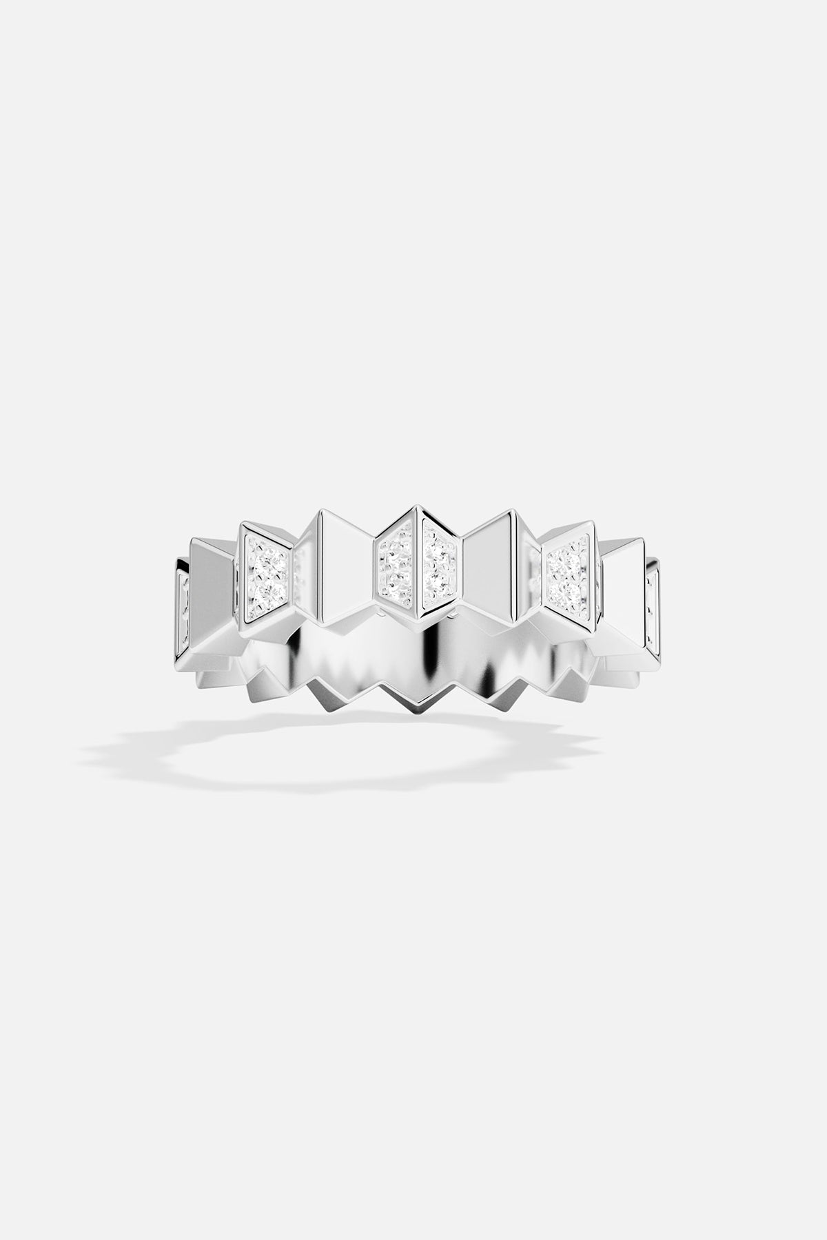 Silver ring with geometric design on a white background