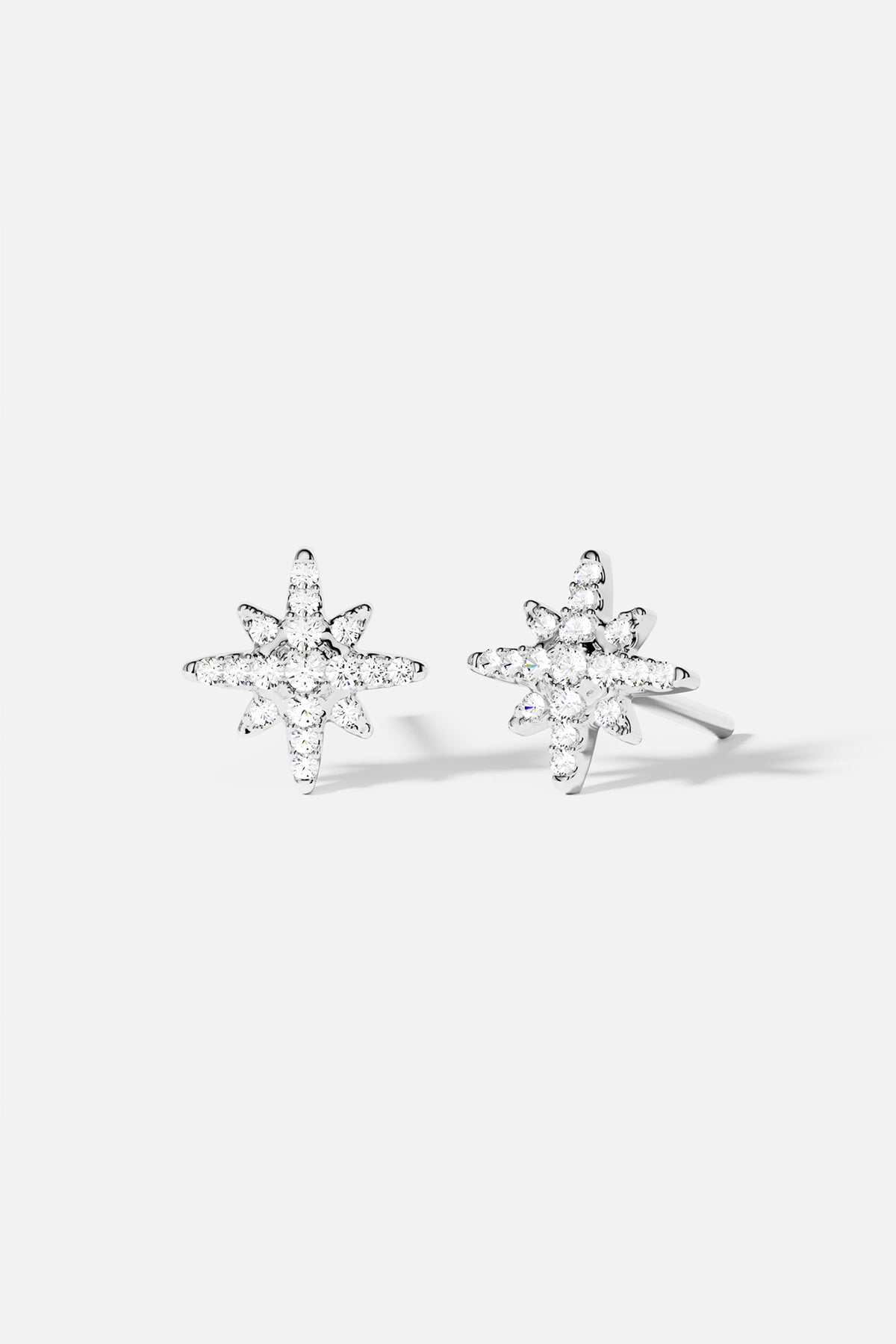 Earrings APM Monaco. silver starshaped stud earrings with meteorite texture.