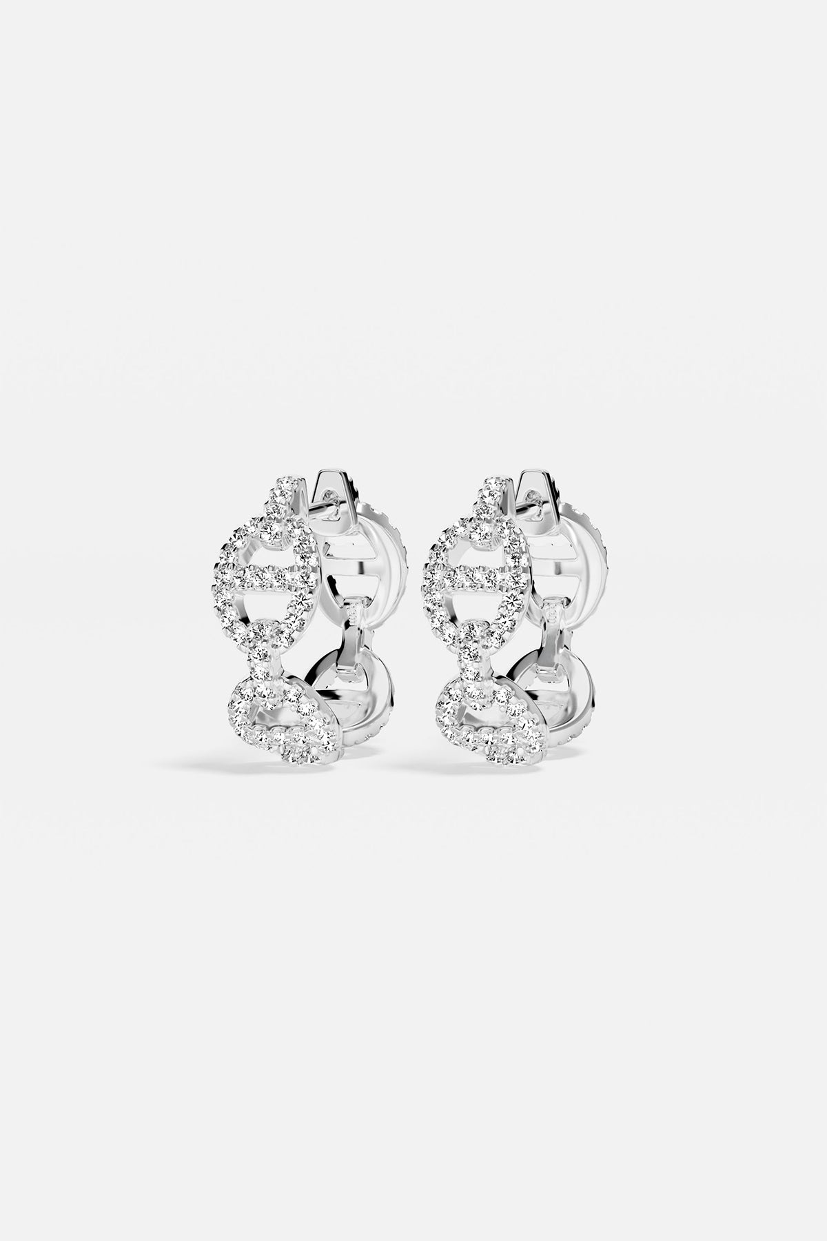 Earrings APM Monaco, silver-tone hoop earrings encrusted with white cubic zirconia.