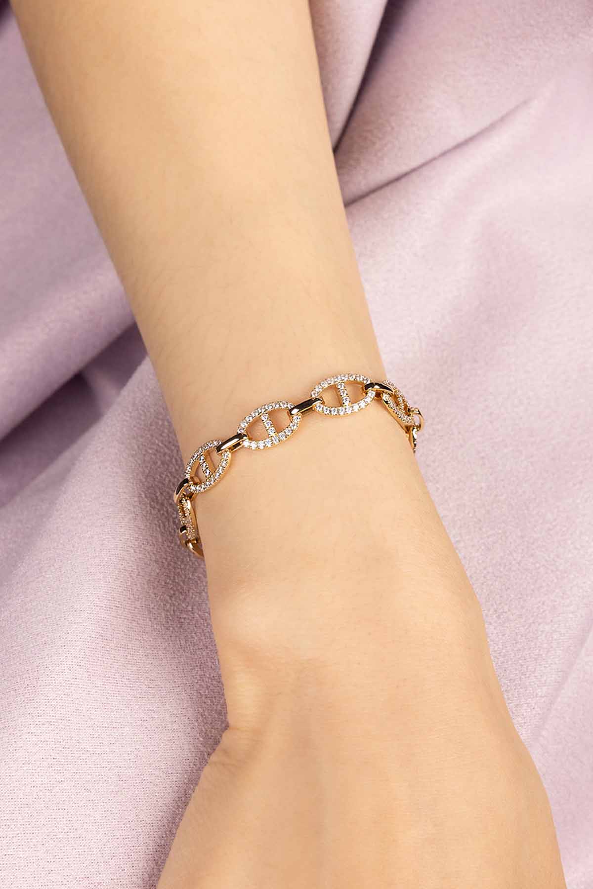 Bracelet on a wrist with a dark background