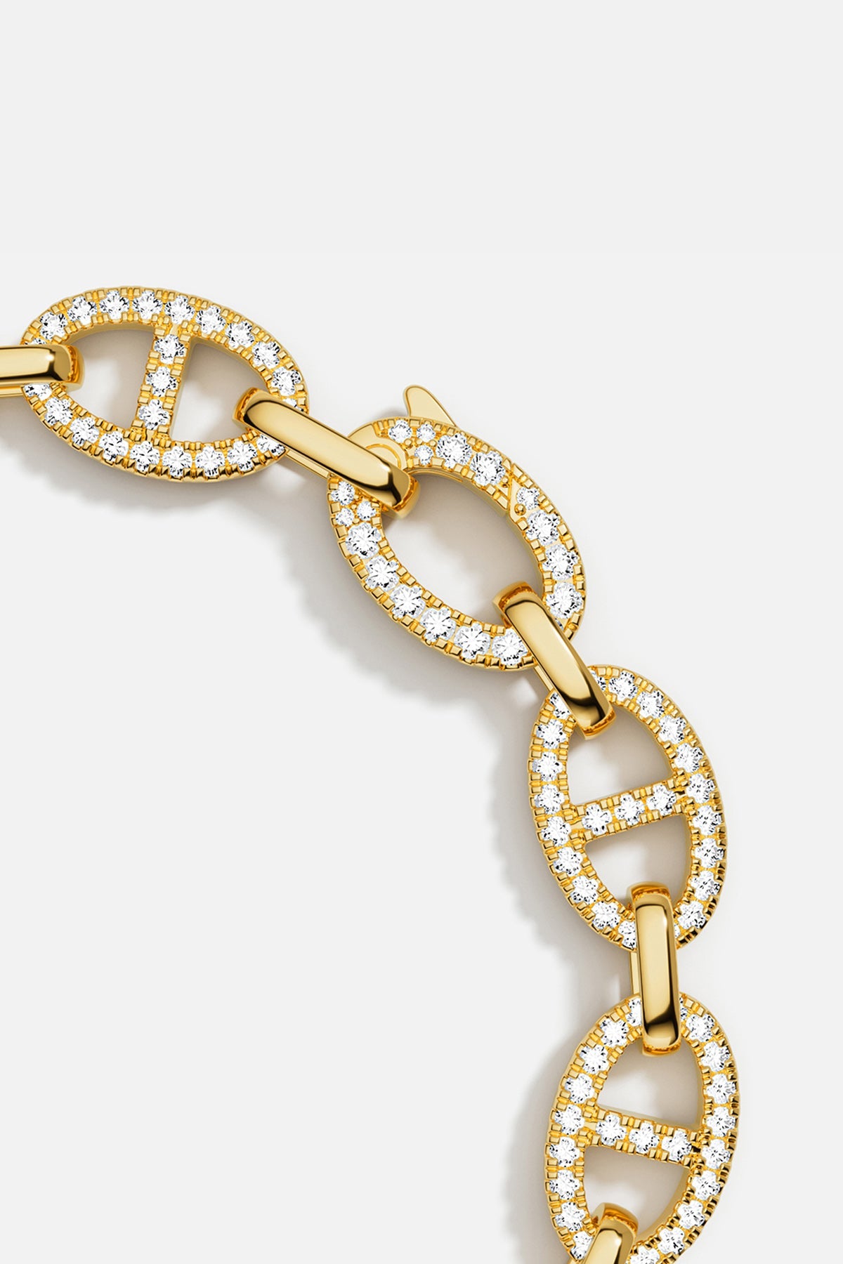 Bracelets APM Monaco: yellow gold chain link bracelet with pavé white cubic zirconia.