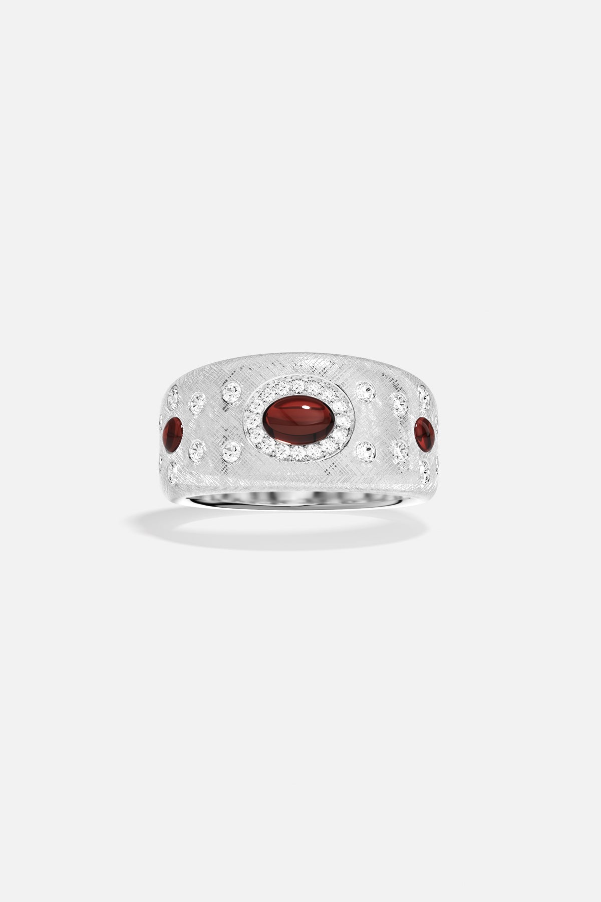 Bague APM Monaco alloy, cabochons rouges et éclats scintillants, allure précieuse et audacieuse.