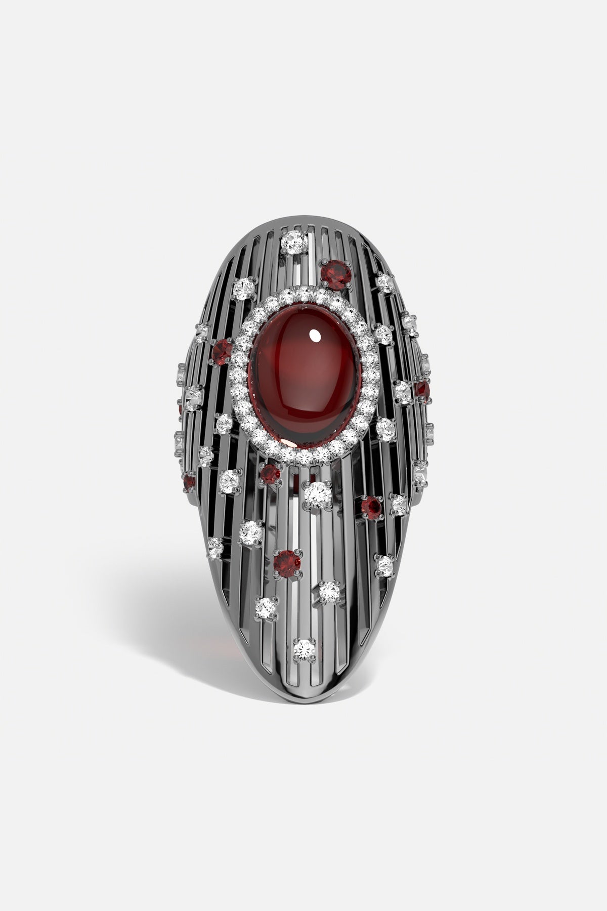 Bague APM, cabochon rouge intense sur finition rhodium, éclat couture affirmé.