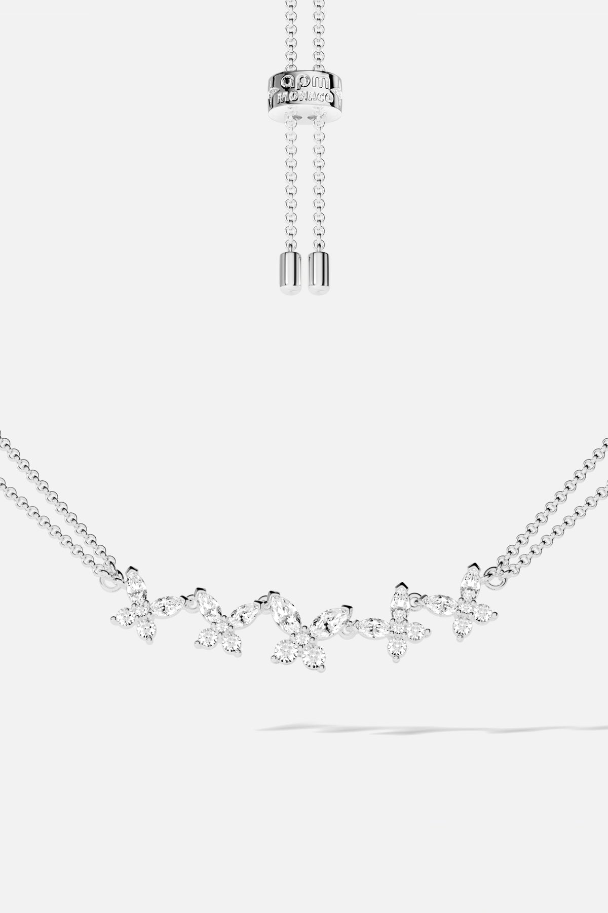 Bracelet APM ajustable, une envolée florale scintillante en finition rhodium.