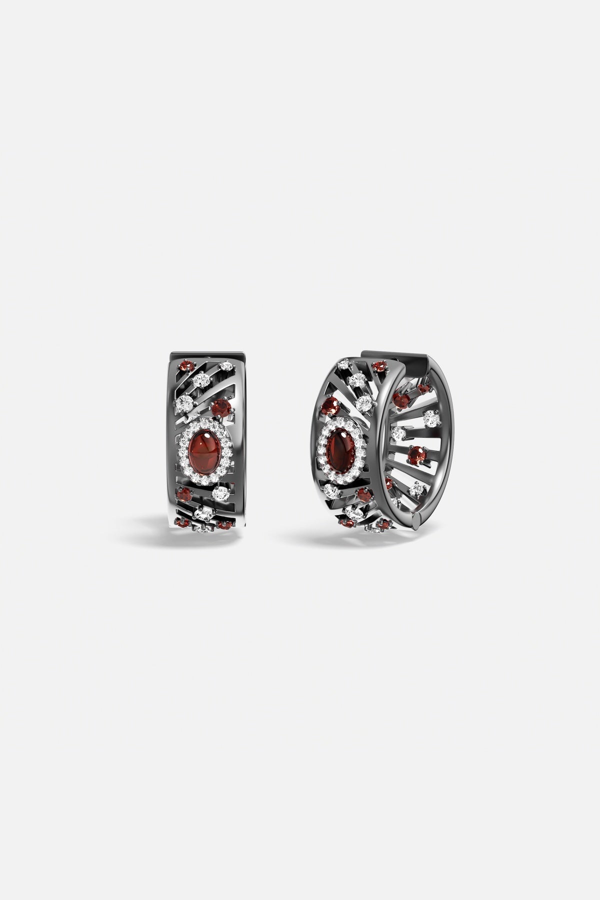 Boucles d'oreilles APM, éclats rouges profonds sur finition rhodium, une allure envoûtante et raffinée.