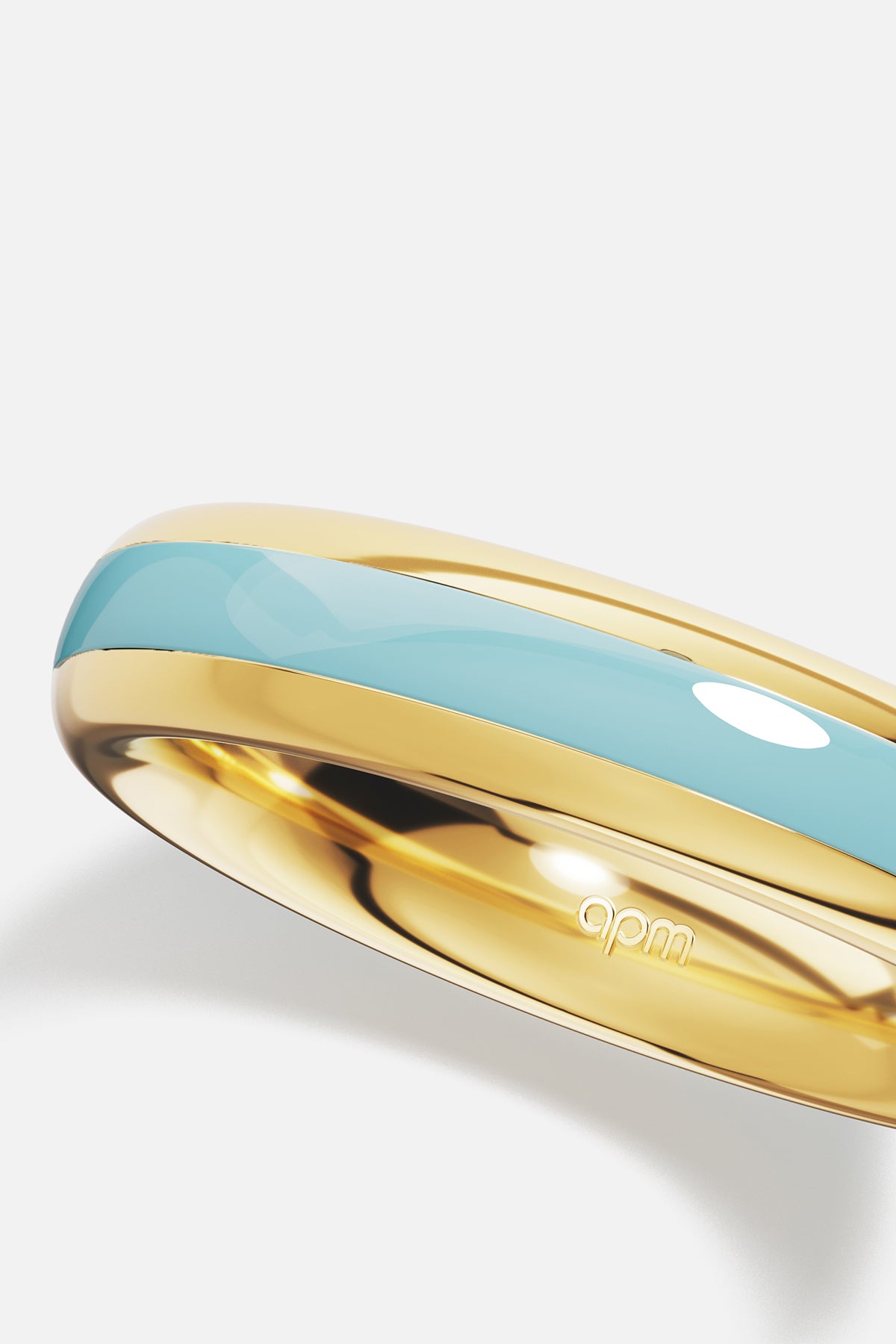 Bague APM aux teintes dorées et bleu turquoise, une douceur lumineuse et intemporelle.