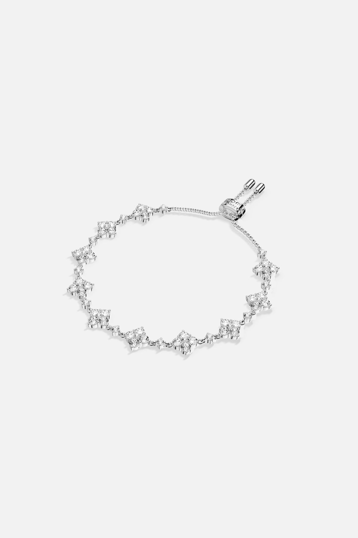 Bracelet APM, une ligne scintillante de fleurs délicates, éclat lumineux au poignet.