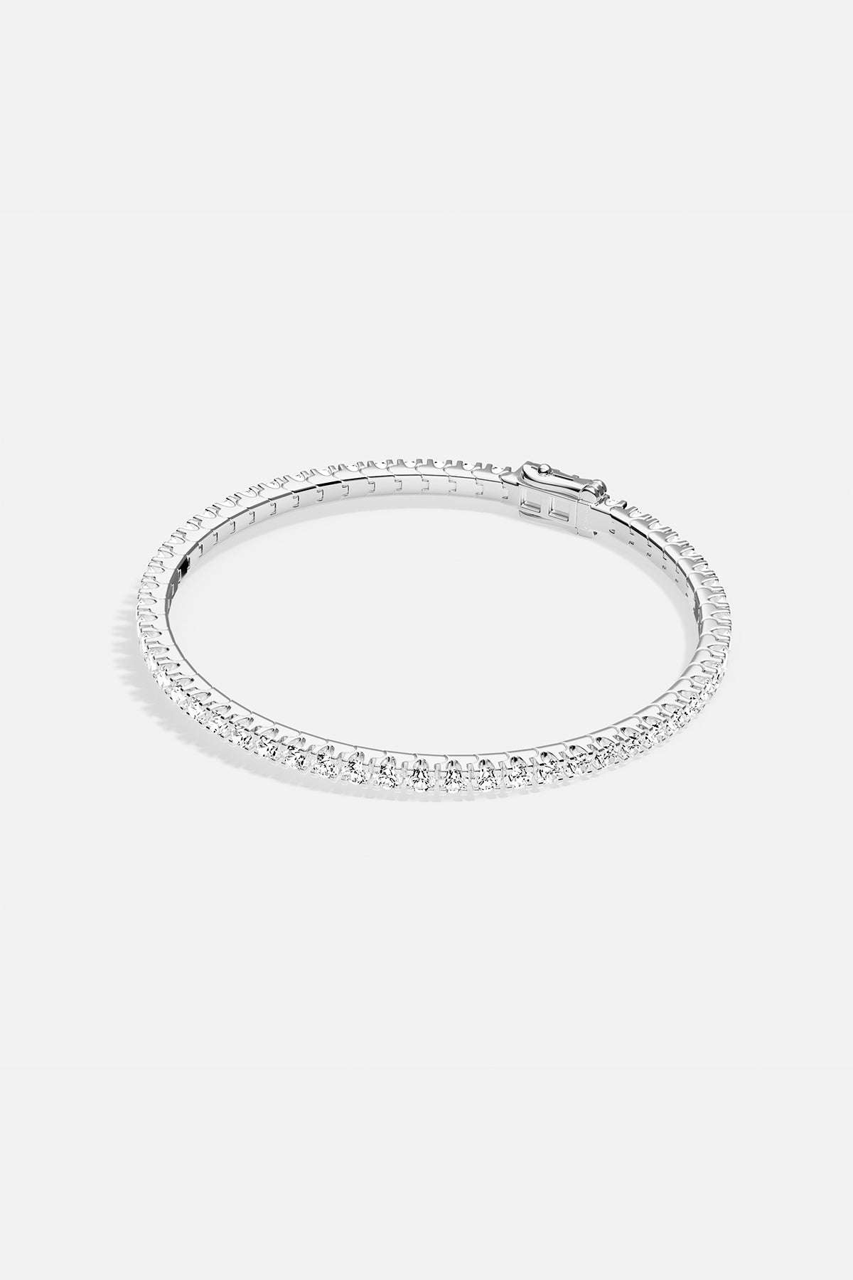 Bracelets APM Monaco pavé white stones on a silver-tone bracelet.