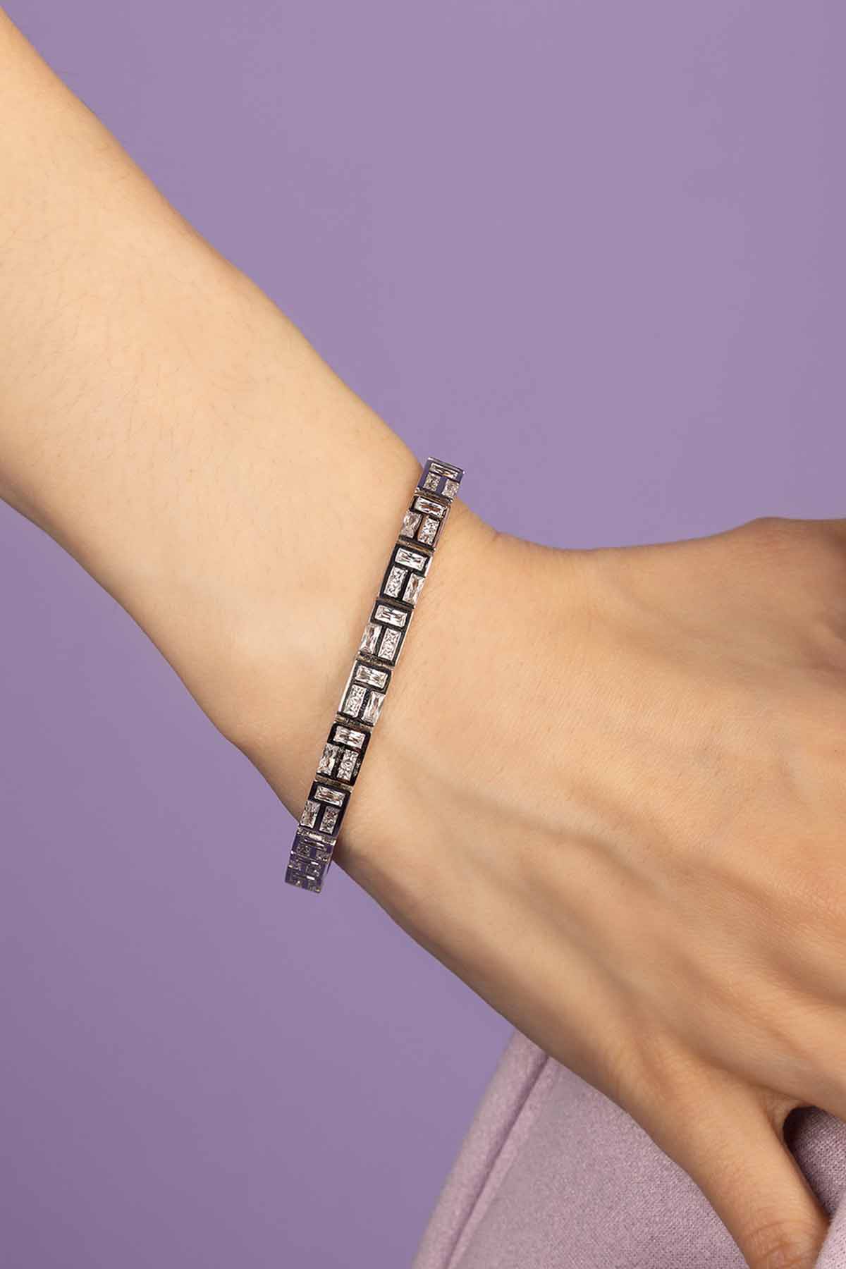 APM MONACO labyrinth bracelet in silver wearing on wrist