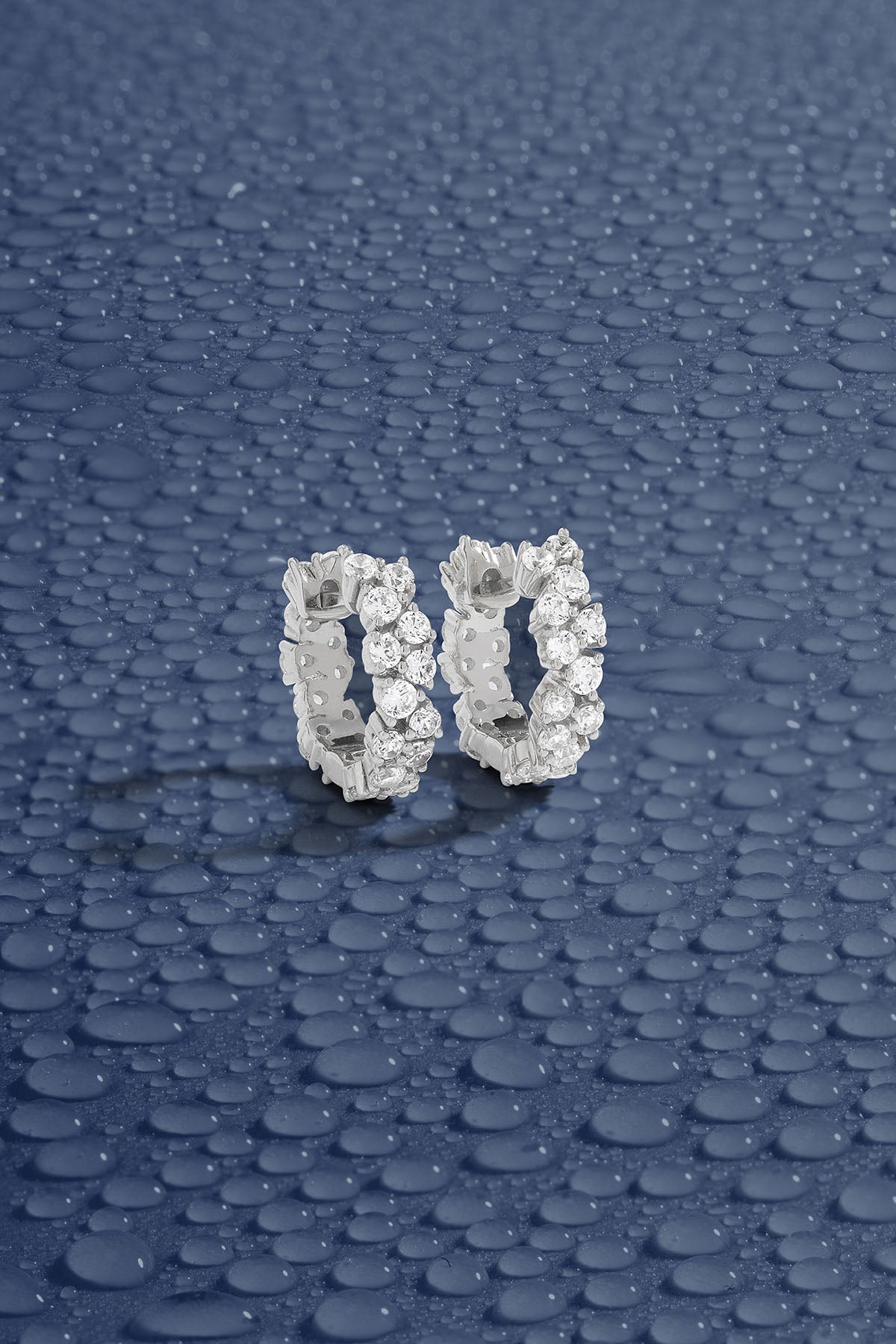 APM Monaco Pave Huggie Earrings in Silver