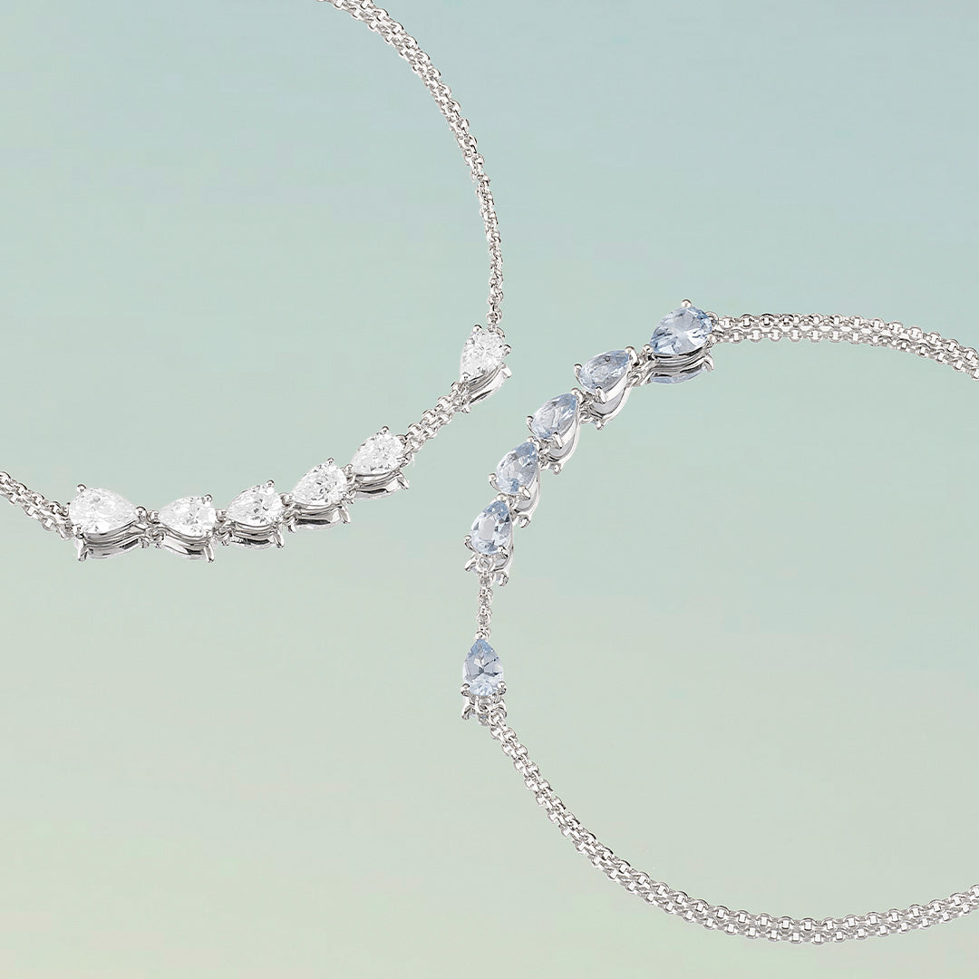 APM Monaco Collection Printemps Drop Bracelets On pastel blue background