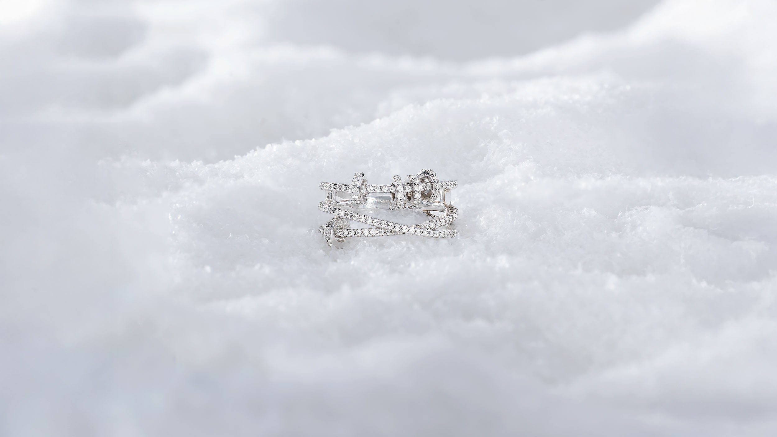 APM MONACO croisette silver ring on snowy surface