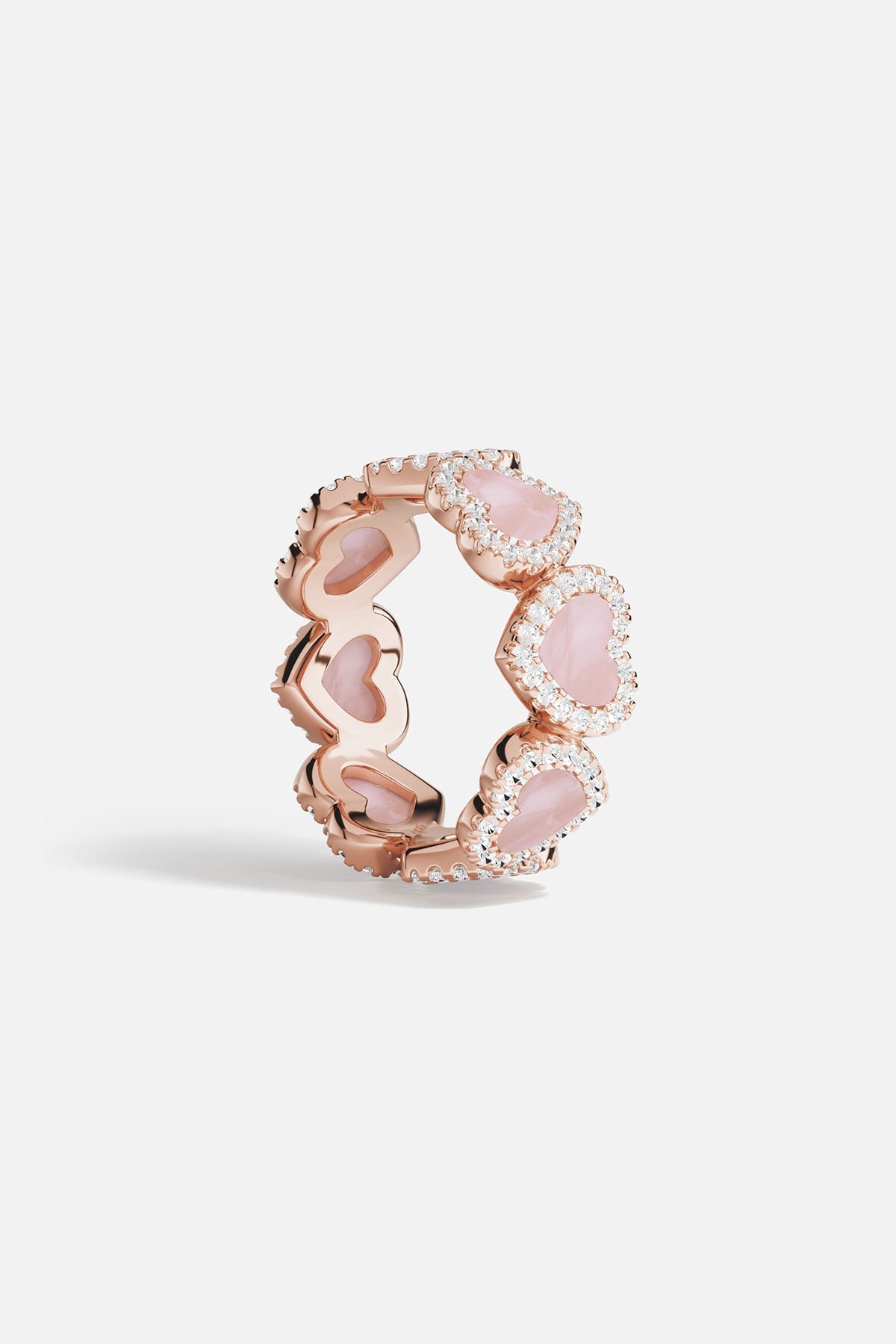 Rings APM Monaco: rose gold pavé ring with pink nacre hearts encircling the band, set with white cubic zirconia