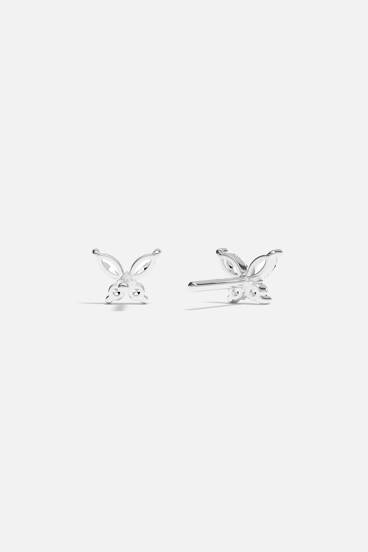 Earrings APM Monaco butterfly stud earrings in silver with gemencrusted wings.
