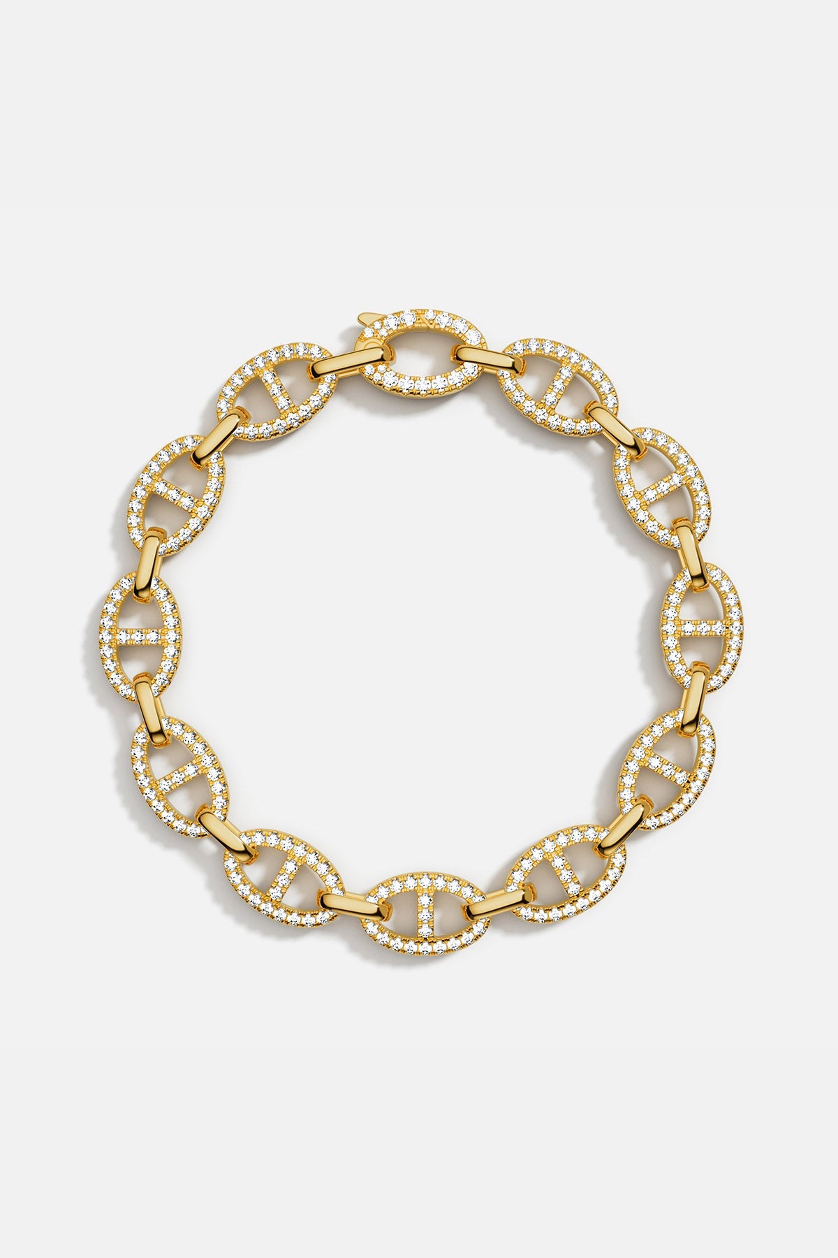 Bracelets APM Monaco: yellow gold chain link bracelet with pavé white cubic zirconia.