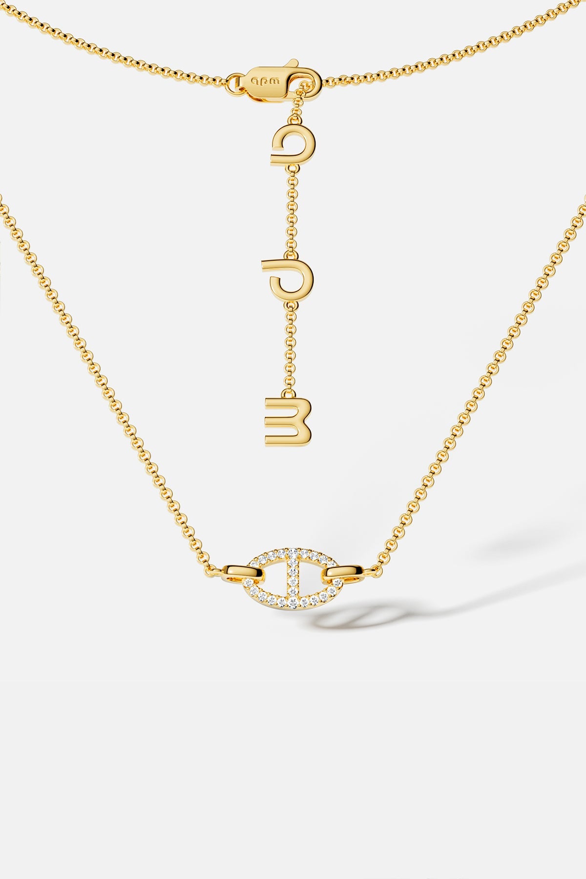 APM Monaco yellow gold necklaces with unique pendant on a white background